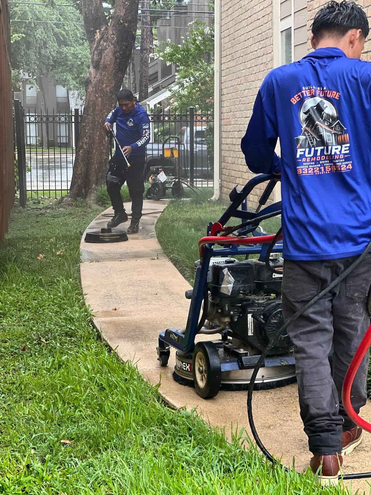 Future Remodeling crew pressure washing a walkway