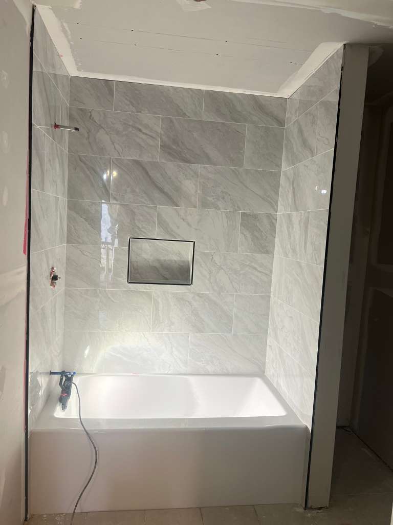 Remodeled bathroom with new bathtub