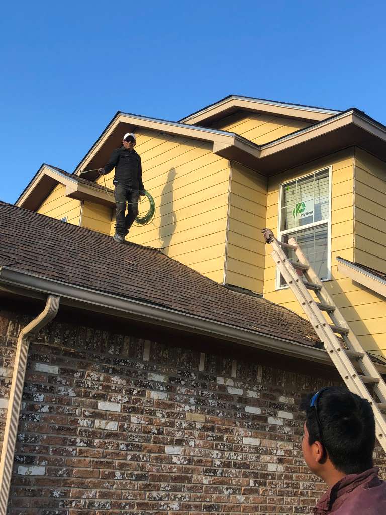 Roofline and siding inspection in progress